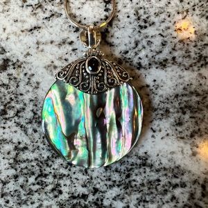Necklace with multiple color shell and silver chain